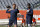 Chicago Bears quarterback Andy Dalton, left, looks to pass as quarterback Justin Fields watches as they warmup before an NFL preseason football game against the Miami Dolphins in Chicago, Saturday, Aug. 14, 2021. (AP Photo/Nam Y. Huh)