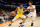 PHOENIX, ARIZONA - OCTOBER 06: Malik Monk #11 of the Los Angeles Lakers handles the ball against Cameron Johnson #23 of the Phoenix Suns during the first half of the NBA preseason game at Footprint Center on October 06, 2021 in Phoenix, Arizona. (Photo by Christian Petersen/Getty Images)