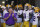 LSU coach Ed Orgeron, left, prepares to lead his team onto the field before an NCAA college football game against UCLA on Saturday, Sept. 4, 2021, in Pasadena, Calif. (AP Photo/Marcio Jose Sanchez)