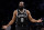 Brooklyn Nets guard James Harden reacts to a play call during the second half of an NBA basketball game against the Charlotte Hornets, Sunday, Oct. 24, 2021, in New York. (AP Photo/John Minchillo)