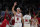 Chicago Bulls guard Alex Caruso celebrates a teammates three-point score during the second half of an NBA preseason basketball gameagainst the Memphis Grizzlies Friday, Oct. 15, 2021, in Chicago. (AP Photo/Charles Rex Arbogast)