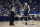 Connecticut's Paige Bueckers with official John Capolino, left, in the first half of an NCAA college basketball game, Sunday, Nov. 14, 2021, in Hartford, Conn. (AP Photo/Jessica Hill)