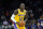 Los Angeles Lakers guard Kendrick Nunn looks to pass the ball against the Phoenix Suns during the first half of a preseason NBA basketball game Wednesday, Oct. 6, 2021, in Phoenix.(AP Photo/Ross D. Franklin)
