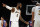 Los Angeles Lakers forwards LeBron James, left, gestures with Anthony Davis during the second half of an NBA basketball game against the Detroit Pistons Sunday, Nov. 28, 2021, in Los Angeles. (AP Photo/Alex Gallardo)