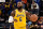 MEMPHIS, TENNESSEE - DECEMBER 09: LeBron James #6 of the Los Angeles Lakers brings the ball up court during the first half against the Memphis Grizzlies at FedExForum on December 09, 2021 in Memphis, Tennessee. NOTE TO USER: User expressly acknowledges and agrees that , by downloading and or using this photograph, User is consenting to the terms and conditions of the Getty Images License Agreement.  (Photo by Justin Ford/Getty Images)