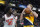 Indiana Pacers' Domantas Sabonis (11) is fouled by New York Knicks' Julius Randle (30) during the second half of an NBA basketball game Wednesday, Dec. 8, 2021, in Indianapolis. (AP Photo/Darron Cummings)