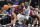 North Carolina Central's Randy Miller Jr. (44) drives the ball to the basket as Memphis' Alex Lomax (10) defends in the second half of an NCAA college basketball game, Saturday, Nov. 13, 2021, in Memphis, Tenn. (AP Photo/Karen Pulfer Focht)