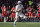 Tulsa quarterback Davis Brin (7) runs with the ball during the first half of an NCAA college football game against Cincinnati on Saturday, Nov. 6, 2021, in Cincinnati. (AP Photo/Jeff Dean)