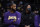 Los Angeles Lakers' LeBron James, left, and Anthony Davis watch from the bench during second half of the team's NBA basketball game against the Phoenix Suns on Tuesday, Dec. 21, 2021, in Los Angeles. The Suns won 108-90. (AP Photo/Jae C. Hong)