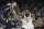 Brooklyn Nets' Kyrie Irving (11) is defended by Indiana Pacers' Duane Washington Jr. (4) during the first half of an NBA basketball game Wednesday, Jan. 5, 2022, in Indianapolis. (AP Photo/Darron Cummings)