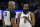 Brooklyn Nets guard James Harden (13) questions referee Kevin Cutler (34) at an NBA basketball game with the Minnesota Timberwolves, Sunday, Jan. 23, 2022, in Minneapolis. (AP Photo/Bruce Kluckhohn)