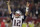 El quarterback Tom Brady de los Patriots de Nueva Inglaterra levanta los brazos luego de que su equipo anotó el touchdown decisivo en la prórroga del Super Bowl ante los Falcons de Atlanta, el domingo 5 de febrero de 2017. (AP Foto/Darron Cummings)