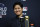FILE - Shohei Ohtani wins the Commissioner's Historic Achievement Award from Rob Manfred before Game 1 in baseball's World Series between the Houston Astros and the Atlanta Braves Tuesday, Oct. 26, 2021, in Houston. Ohtani was among the athletes who either won or lost the most money for sports bettors in 2021, according to several national sports books. (AP Photo/Ashley Landis, File)