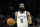 Brooklyn Nets guard James Harden (13) looks to pass against the Phoenix Suns during the first half of an NBA basketball game, Tuesday, Feb. 1, 2022, in Phoenix. (AP Photo/Matt York)