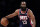 Brooklyn Nets guard James Harden (13) looks to pass against the Philadelphia 76ers during the second half of an NBA basketball game Thursday, Dec. 30, 2021, in New York. 76ers won 110-102. (AP Photo/Adam Hunger)