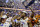 Auburn players celebrates winning the Southeastern Conference regular season championship after an NCAA college basketball game against South Carolina, Saturday, March 5, 2022, in Auburn, Ala. (AP Photo/Butch Dill)