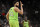 Minnesota Timberwolves' Karl-Anthony Towns celebrates a 3-point basket late in the second half of an NBA basketball game against the San Antonio Spurs on Monday, March 14, 2022, in San Antonio. (AP Photo/Darren Abate)