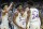 Kansas' Ochai Agbaji (30) celebrates with Jalen Wilson (10), Remy Martin (11) and KJ Adams (24) after their win against Villanova in a college basketball game in the semifinal round of the Men's Final Four NCAA tournament, Saturday, April 2, 2022, in New Orleans. (AP Photo/David J Phillip)