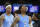 North Carolina's Caleb Love (2) and Armando Bacot (5)