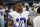 Dallas Cowboys wide receiver Amari Cooper walks in the bench area during the first half of an NFL football game against the Washington Football Team in Arlington, Texas, Sunday, Dec. 26, 2021. (AP Photo/Roger Steinman)