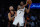 New York Knicks' Evan Fournier (13) defends Brooklyn Nets' Kevin Durant (7) during the second half of an NBA basketball game Wednesday, April 6, 2022, in New York. The Nets won 110-98. (AP Photo/Frank Franklin II)