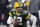 FILE - In this Jan 16, 2021 file photo, Green Bay Packers quarterback Aaron Rodgers (12) runs during an NFL playoff against the Los Angeles Rams in Green Bay, Packers general manager Brian Gutekunst says the team does not Still committed to Rodgers 