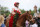 LOUISVILLE, KY - MAY 07: Jockey Sonny Leon aboard Rich Strike (21) is paraded in the winner's circle after winning the148th running of the Kentucky Derby on May 7th, 2022, at Churchill Downs in Louisville, Kentucky. (Photo by Brian Spurlock/Icon Sportswire via Getty Images)