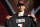 Southern California wide receiver Drake London holds a jersey after being chosen by the Atlanta Falcons with the eighth pick of the NFL football draft Thursday, April 28, 2022, in Las Vegas. (AP Photo/John Locher)