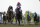 Jose Ortiz, center, atop Early Voting, edges out Joel Rosario, center left, atop Epicenter, to win during the 147th running of the Preakness Stakes horse race at Pimlico Race Course, Saturday, May 21, 2022, in Baltimore. (AP Photo/Julio Cortez)