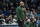 Milwaukee Bucks acting head coach Darvin Ham looks on during the first half of an NBA basketball game against the Charlotte Hornets, Saturday, Jan. 8, 2022, in Charlotte, N.C. (AP Photo/Matt Kelley)
