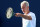 John McEnroe and his famous left hand, still in action.