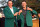 Charl Schwartzel accepts the green jacket from 2010 Masters champion Phil Mickelson.