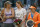 Maria Sharapova and former world No. 1 Dinara Safina chat as Simona Halep looks away during the trophy ceremony in Madrid.