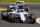 Valtteri Bottas with the offending right-rear tyre.