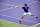 Novak Djokovic stretches to make a play on the ball during his semifinals match.