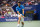 Djokovic slaps a backhand in a fourth-round match against Kyle Edmund.