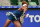 Naomi Osaka hits a forehand during a match at the 2016 U.S. Open.