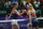 Simona Halep, left, and Dominika Cibulkova shake hands after a match at the 2016 WTA Finals in Singapore.