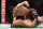 Islam Makhachev (top) knocked out Gleison Tibau in the evening's first bout.