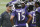 Baltimore Ravens head coach John Harbaugh speaks with wide receiver Michael Crabtree (15) and John Brown (13).