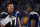 Los Angeles Chargers quarterbacks Philip Rivers (left) and Geno Smith (right)