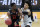 Oregon State's Warith Alatishe and Oklahoma State's Cade Cunningham