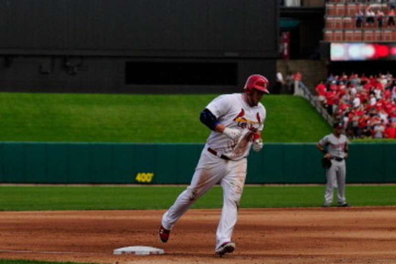 Allen Craig #21 of the St. Louis Cardinals throws to first base against the  Kansas City Royals on May 22, 2011 in Kansas City, Mo. The Cardinals  defeated the Royals 9-8 in