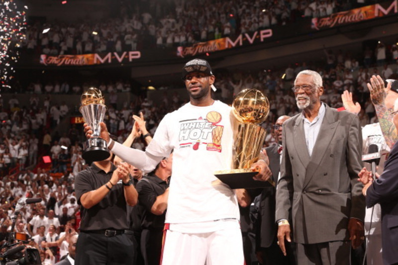 MIAMI, FL - JUNE 20: Basketball legend Bill Russell presents LeBron James #6 of the Miami Heat with the Bill Russell NBA Finals Most Valuable Player Award after the Miami Heat defeat the San Antonio Spurs in Game Seven of the 2013 NBA Finals on June 20, 2