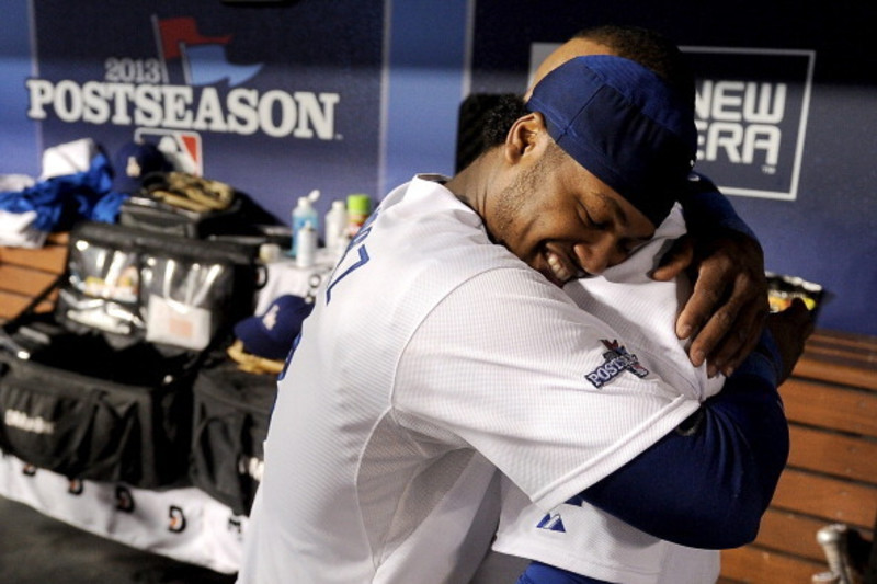 Bench coach, Hanley Ramirez and manager, Juan Uribe