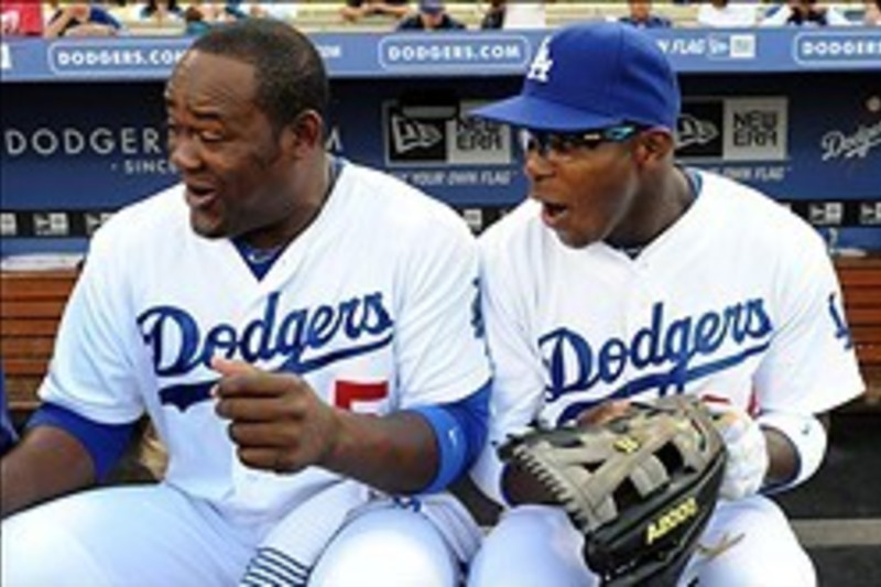 Bench coach, Hanley Ramirez and manager, Juan Uribe