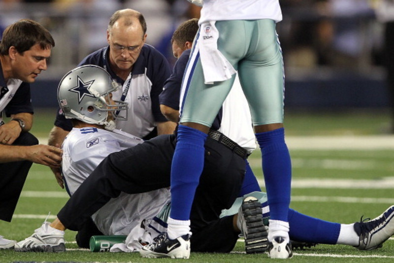 Dallas Cowboys quarterback Tony Romo, with his left arm in a sling, leaves  a press conference after an NFL football game against the Carolina  Panthers, Thursday, Nov. 26, 2015, in Arlington, Texas.