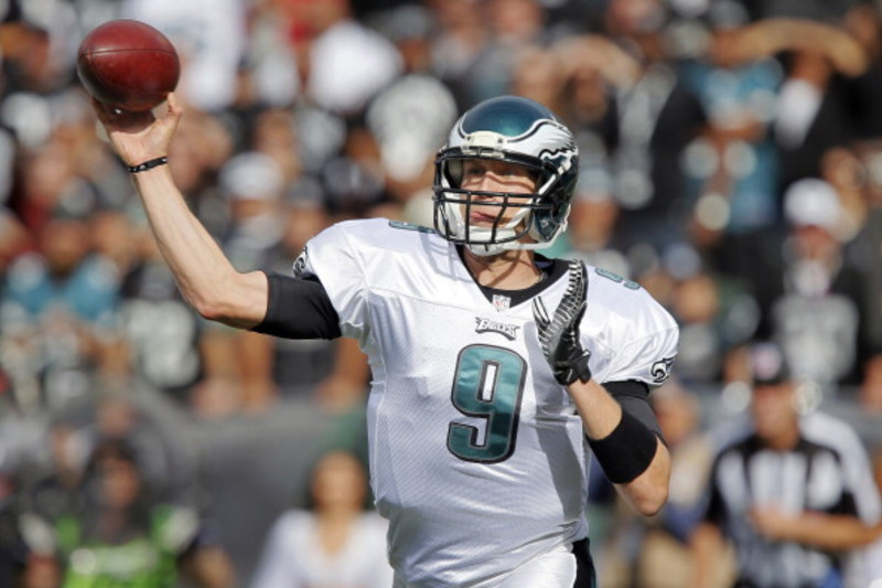 Eagles quarterback NICK FOLES receives a touchdown pass just before half  time