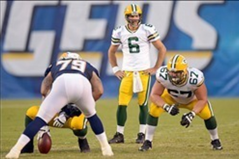 Green Bay Packers center Evan Dietrich-Smith (62) provides pass protection  for quarterback Aaron Rodgers during the second quarter of their game  against the Tennessee Titans at Lambeau Field on Sunday, December 23