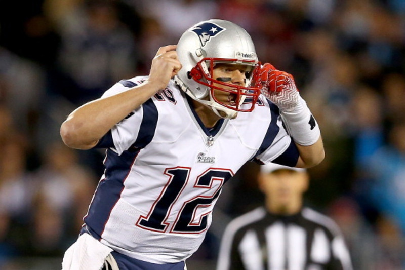 New England Patriots quarterback Tom Brady (12) stretches during pregame at  Bank of America Stadium September 18 in Charlotte, NC. The Patriots lost  27-17 to the Carolina Panthers and both evened their